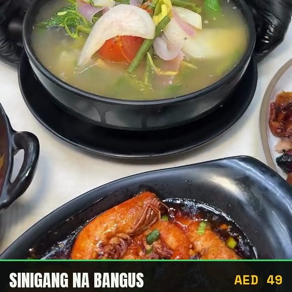 Sinigang na bangus served in the kitchen